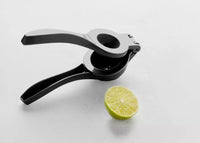 Presse-citron et citron vert noir